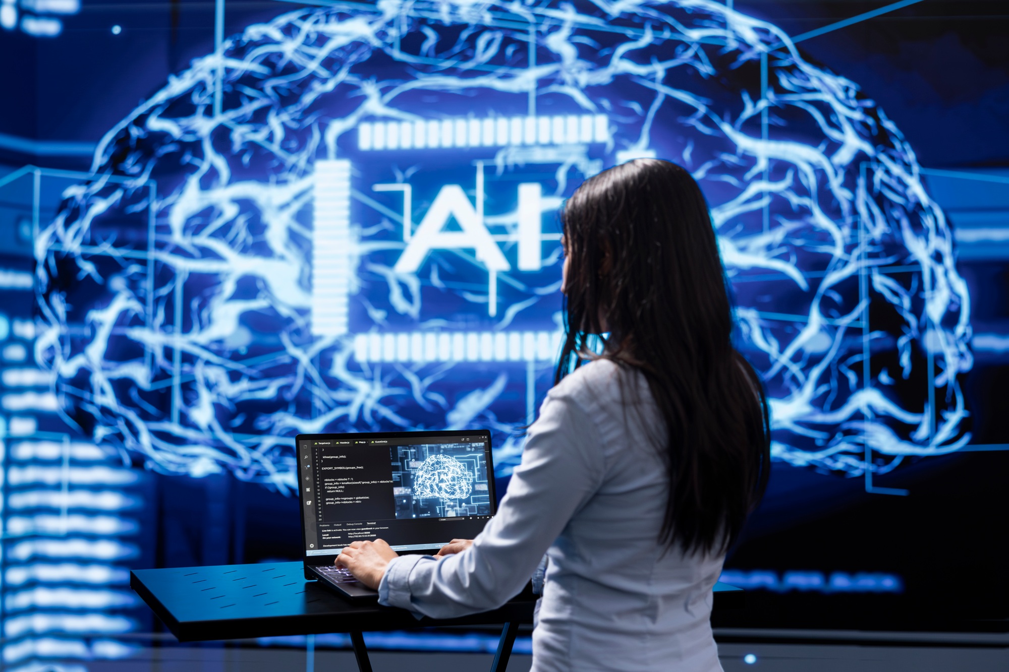 Programmer analyzing complex AI brain models on laptop, running simulations